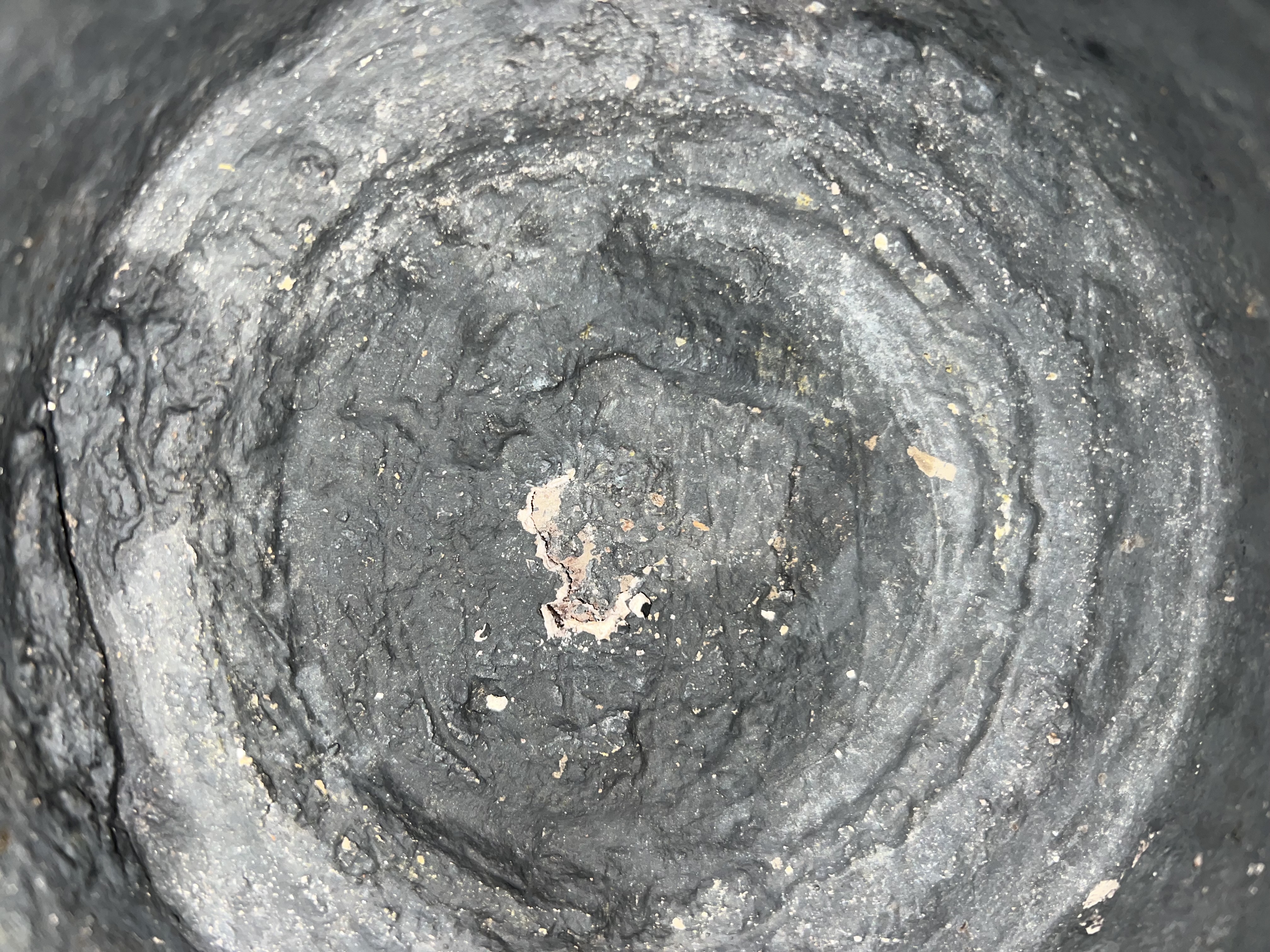 Before restoration: Layers of scale and an unknown black substance concealed the kettle’s true condition